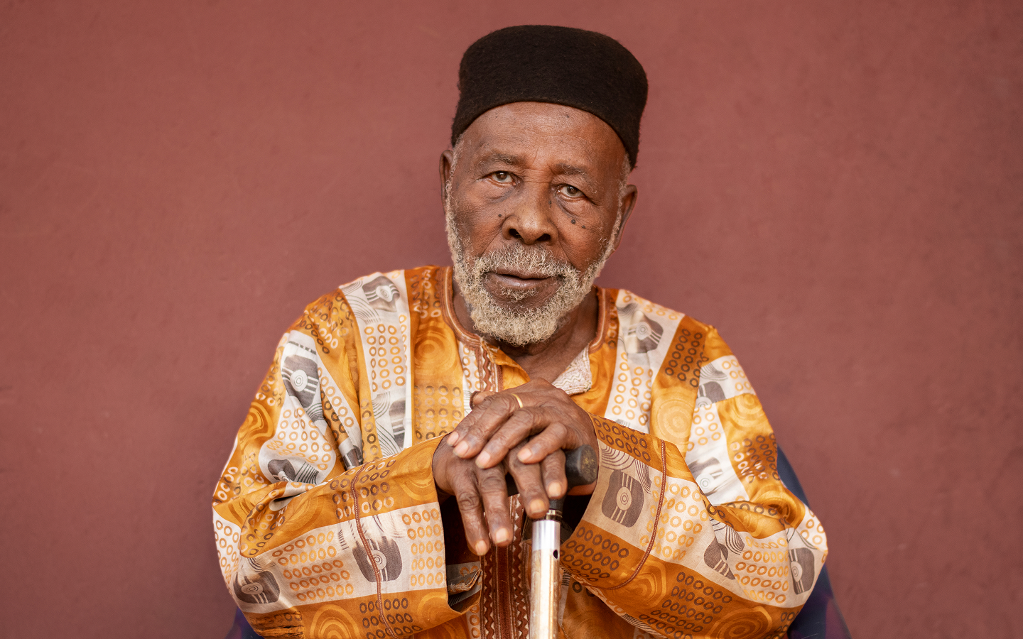 Portrait of an elder man — representing Chike Nwegbu